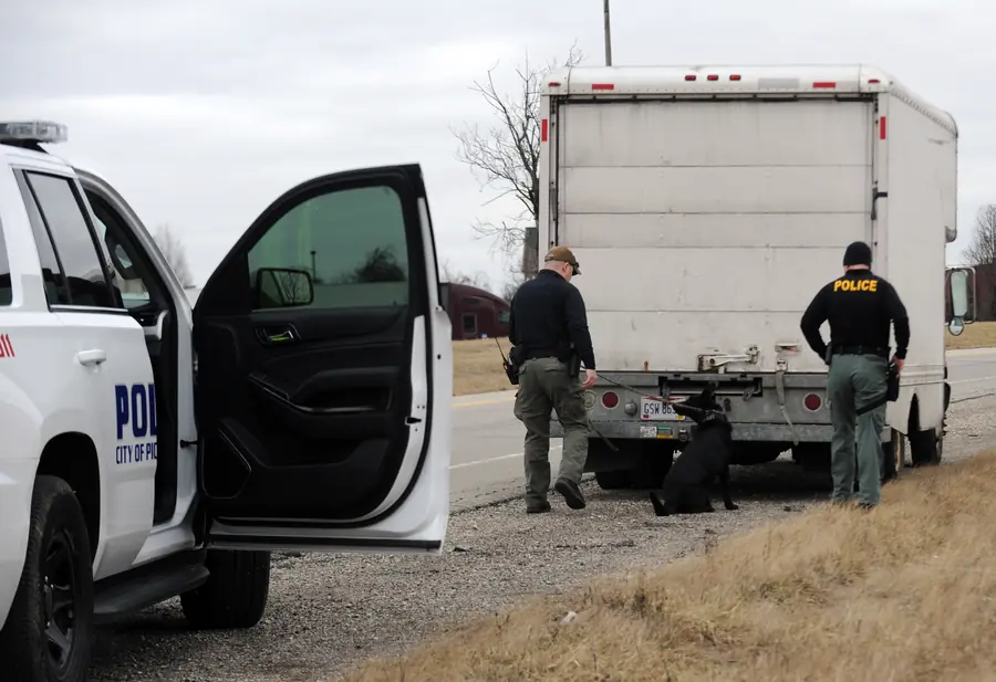MCU interdiction officer and K9 partner with a Pickerington police officer at a stopped box truck